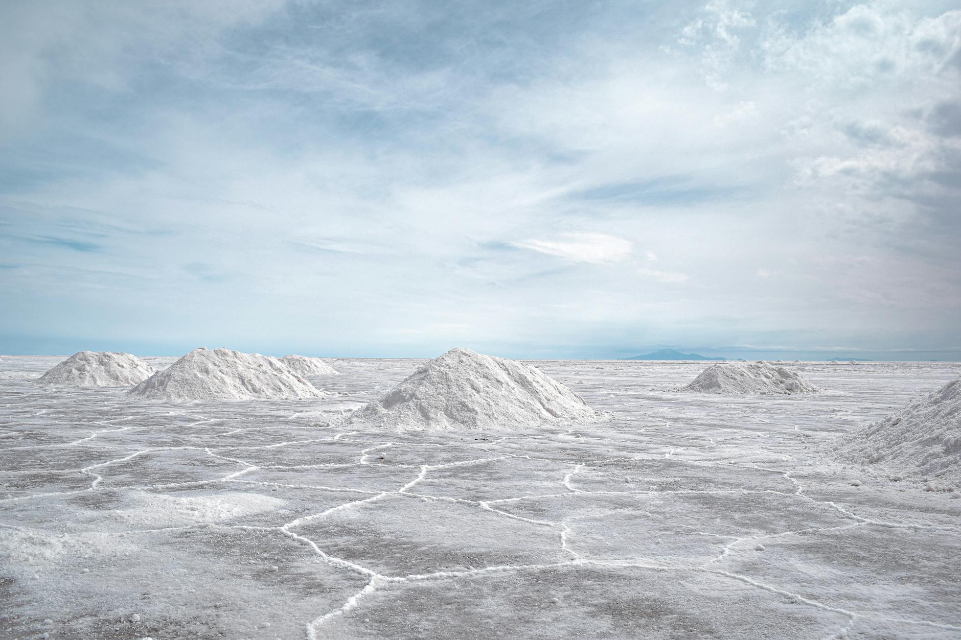 salt flats in the desert with a blue sky